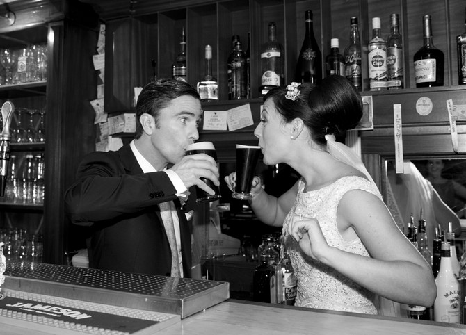 bride and groom drinking guinness wedding